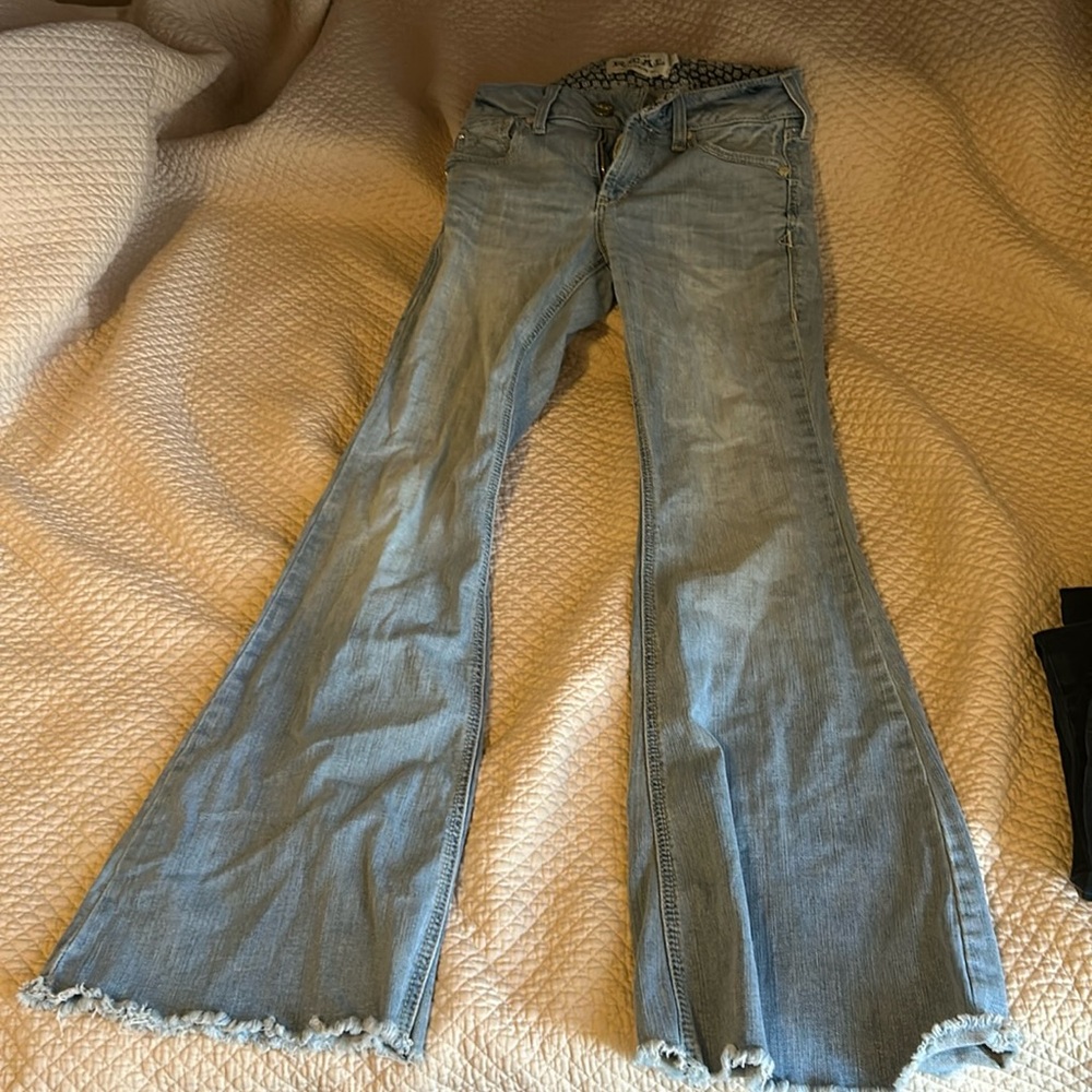 Selling Ariat jeans light blue bell bottoms.